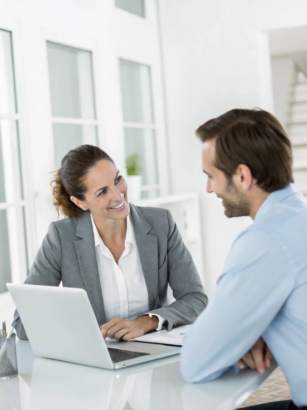 A consultant advising a client in an office setting, illustrating Lathrop's Business Systems' consulting services.
